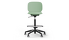 Aarhus Swivel Counter Stool by Quell Design in morandi green positioned around a modern kitchen island with wooden countertops and pendant lighting. Featuring a smooth moulded polypropylene seat, adjustable gas-lift height, 360-degree swivel, integrated footrest ring, and sturdy five-star base, this Scandinavian-inspired stool blends ergonomic comfort with minimalist contemporary style for residential and commercial interiors.