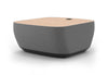 Byorne Connected Modular Coffee Table shown in dusty teal, dark grey and pebble grey finishes, featuring durable linen fabric upholstery, softly rounded edges and an injection moulded nylon leg for stability. Designed as part of a modular seating system, the table includes integrated USB ports and wireless charging to support modern work and lounge environments while maintaining a clean, contemporary aesthetic suitable for collaborative offices, reception areas and breakout spaces.