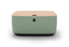 Byorne Connected Modular Coffee Table shown in dusty teal, dark grey and pebble grey finishes, featuring durable linen fabric upholstery, softly rounded edges and an injection moulded nylon leg for stability. Designed as part of a modular seating system, the table includes integrated USB ports and wireless charging to support modern work and lounge environments while maintaining a clean, contemporary aesthetic suitable for collaborative offices, reception areas and breakout spaces.