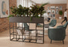 Maxi Office Biophilia Planter in black placed in a modern office interior with exposed brick walls, wooden flooring and high ceilings, featuring E0-grade MFC panels and a powder-coated steel frame; contemporary biophilic planter designed for workspace organisation and natural greenery integration.