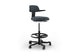 Tulip Adjustable Swivel Stool with integrated armrest and ergonomic support features, available in dark grey, light grey, orange and green. Designed with an adjustable backrest, sliding seat and tilting back support to encourage movement and reduce fatigue, it includes a smooth swivel function and round steel footrest for stability in modern offices and collaborative workspaces.