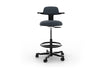 Tulip Adjustable Swivel Stool with integrated armrest and ergonomic support features, available in dark grey, light grey, orange and green. Designed with an adjustable backrest, sliding seat and tilting back support to encourage movement and reduce fatigue, it includes a smooth swivel function and round steel footrest for stability in modern offices and collaborative workspaces.