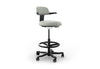 Tulip Adjustable Swivel Stool with integrated armrest and ergonomic support features, available in dark grey, light grey, orange and green. Designed with an adjustable backrest, sliding seat and tilting back support to encourage movement and reduce fatigue, it includes a smooth swivel function and round steel footrest for stability in modern offices and collaborative workspaces.