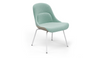 Bloom ergonomic office chair by Quell Design — pastel aqua upholstered contoured seat with linen-velvet and eco PU panels, mounted on slender black steel legs with subtle wraparound support structure. Elegant and sculptural, the chair adds refined comfort and modern design to contemporary interiors.