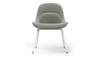Bloom ergonomic office chair by Quell Design — soft light grey upholstered contoured seat with linen-velvet and eco PU panels, mounted on slender black steel legs with subtle wraparound support structure. Elegant and sculptural, the chair adds refined comfort and modern design to contemporary interiors.
