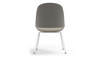 Bloom ergonomic office chair by Quell Design — soft light grey upholstered contoured seat with linen-velvet and eco PU panels, mounted on slender black steel legs with subtle wraparound support structure. Elegant and sculptural, the chair adds refined comfort and modern design to contemporary interiors.